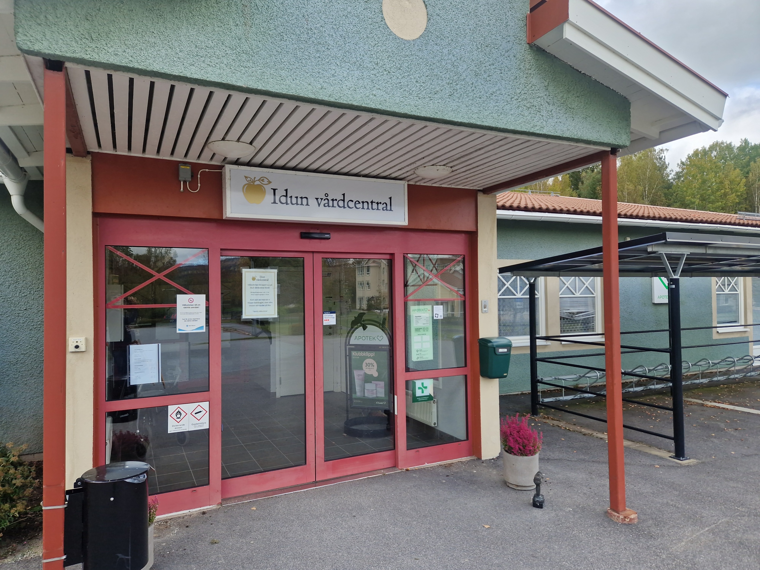 white van parked beside brown building